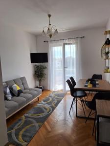 a living room with a couch and a table at House Roca in Vodice