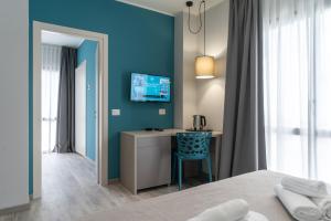 A bed or beds in a room at Hotel Cristina