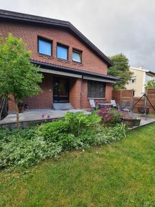 En hage utenfor DT Serene Villa - Lillestrøm + 8 bilder