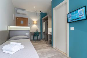 A bed or beds in a room at Hotel Cristina