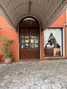 an entrance to a building with a large wooden door at Nuevo Hotel Beltran in Colonia del Sacramento