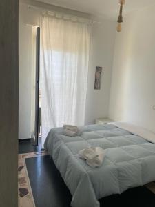Ένα ή περισσότερα κρεβάτια σε δωμάτιο στο Piccolo Hotel di Lavagna