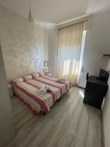 Ένα ή περισσότερα κρεβάτια σε δωμάτιο στο Piccolo Hotel di Lavagna