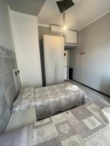 Ένα ή περισσότερα κρεβάτια σε δωμάτιο στο Piccolo Hotel di Lavagna