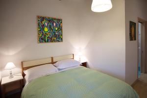 Postel nebo postele na pokoji v ubytování Agriturismo Fattoria Loppiano 4-0
