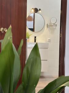 a bathroom with a sink and a mirror at Casa Rural Puebla Deluxe l Privacidad e intimidad in Puebla de Alcocer +54 photos