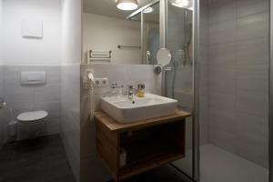 Koupelna v ubytování Collina Hotel Garni