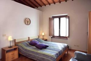 Postel nebo postele na pokoji v ubytování Agriturismo Fattoria Loppiano 4-0