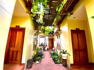 a hallway of a building with plants on the ceilings at Liên Tho Hotel Phú Quốc in Phu Quoc