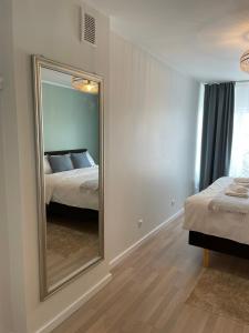 Postel nebo postele na pokoji v ubytování Raunex Apartment