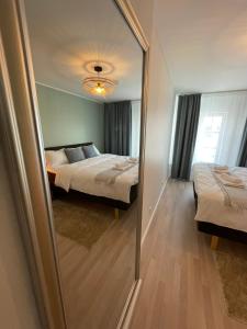 Postel nebo postele na pokoji v ubytování Raunex Apartment
