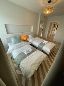 Postel nebo postele na pokoji v ubytování Raunex Apartment