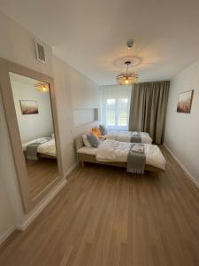 Postel nebo postele na pokoji v ubytování Raunex Apartment