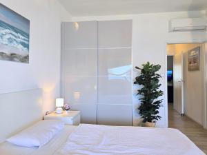 Ein Bett oder Betten in einem Zimmer der Unterkunft Apartment Villa Bralo