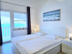 Ein Bett oder Betten in einem Zimmer der Unterkunft Apartment Villa Bralo