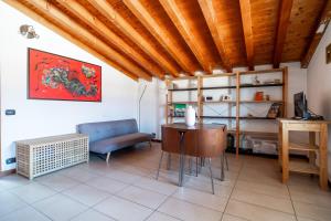 a living room with a table and a couch at TAKE OFF Airport House in Orio al Serio
