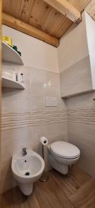 a bathroom with a toilet and a sink at La casa del Maestro - Gallipoli - centro storico in Gallipoli +20 photos