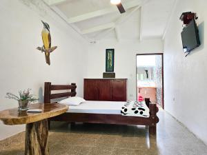 Voodi või voodid majutusasutuse EcoHotel El Castillo Pance toas