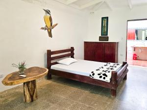 Voodi või voodid majutusasutuse EcoHotel El Castillo Pance toas