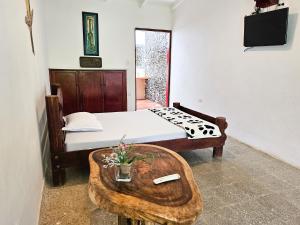 Voodi või voodid majutusasutuse EcoHotel El Castillo Pance toas