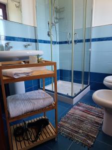 a bathroom with a sink and a shower at Il Maestrale B&B in Castellabate