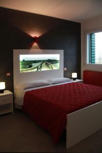 מיטה או מיטות בחדר ב-Oasi Bianca