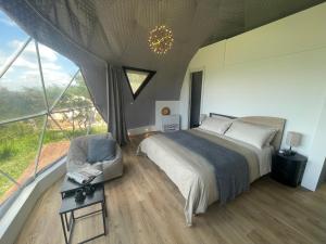 Voodi või voodid majutusasutuse Aura - Glamping Experience toas