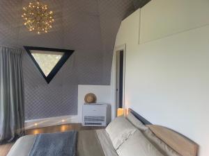 Voodi või voodid majutusasutuse Aura - Glamping Experience toas