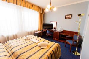 Una cama o camas en una habitación de Penzion U Raušů