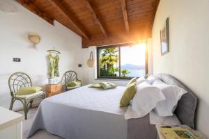 Postel nebo postele na pokoji v ubytování Hotel La Rondinella