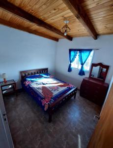Postel nebo postele na pokoji v ubytování Cabañas Alma Fuerte