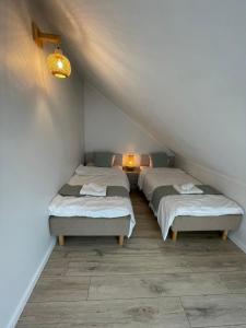 Postel nebo postele na pokoji v ubytování Raunex Apartment