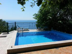 a swimming pool with a view of the ocean at Apartment Sofia in Sutomore