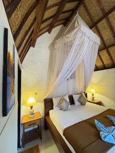 Postel nebo postele na pokoji v ubytování KABY Bungalows