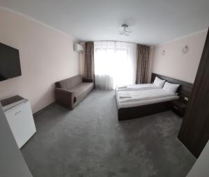 Postel nebo postele na pokoji v ubytování Cazare Folea Central + 11 fotografií