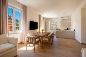 a kitchen and dining room with a table and chairs at TOP CLASS Al Mare in Santa Margherita Ligure