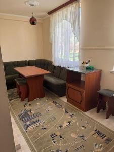a living room with a couch and a table at Apartment in Jermuk, ARMENIA in Jermuk