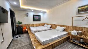 a small room with two beds in it at TaHien Loft in Hanoi