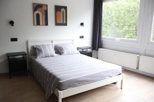Postel nebo postele na pokoji v ubytování Le Carlton