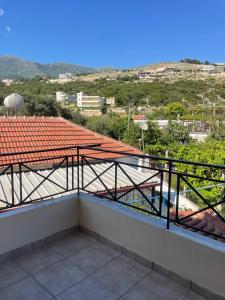 a balcony with a view of a roof at Marina Apartaments in Himare