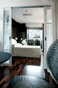 a bedroom with a bed and a large mirror at Victoria Hotel in Pescara