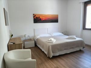 A bed or beds in a room at Passi Alterni Apartments