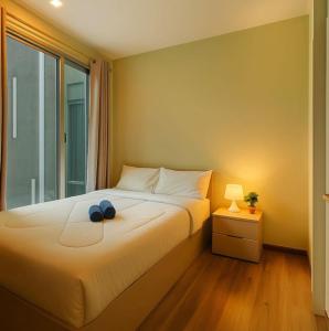 Voodi või voodid majutusasutuse Sansiri Overwatch 1Bedroom Condo - BTS ThongLor toas