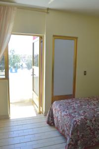 Postel nebo postele na pokoji v ubytování Hotel Topacio