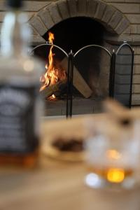 a brick oven with a fire in it at Rent House Dilijan in Dilijan