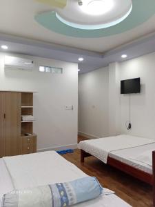 Postel nebo postele na pokoji v ubytování HOTEL MOTeL ĐỒNG KHỞI + 37 fotografií