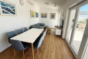 a dining room with a table and chairs at Villa Velim - Stunning view & Heated private pool in Stankovci