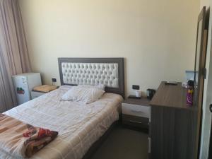 Postel nebo postele na pokoji v ubytování Alfares Hotel