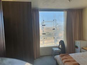 Postel nebo postele na pokoji v ubytování Alfares Hotel