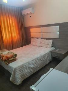 Postel nebo postele na pokoji v ubytování Alfares Hotel